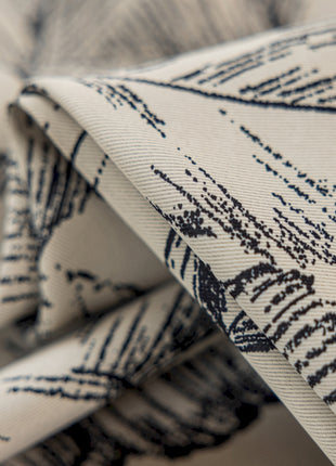 a close up of a tie with a design on it