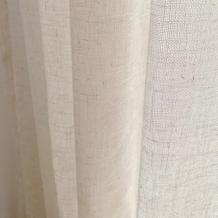 a close up of a curtain with a white background