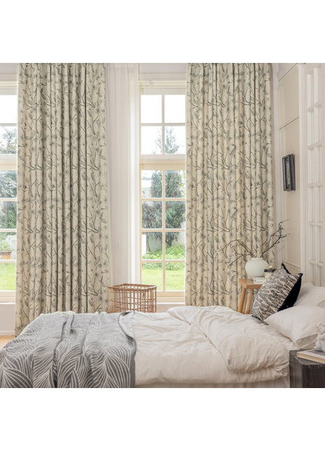 a bedroom with a bed and two windows